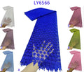 Blue lace scarf with fringe on a white background, surrounded by other scarves in different colors.
