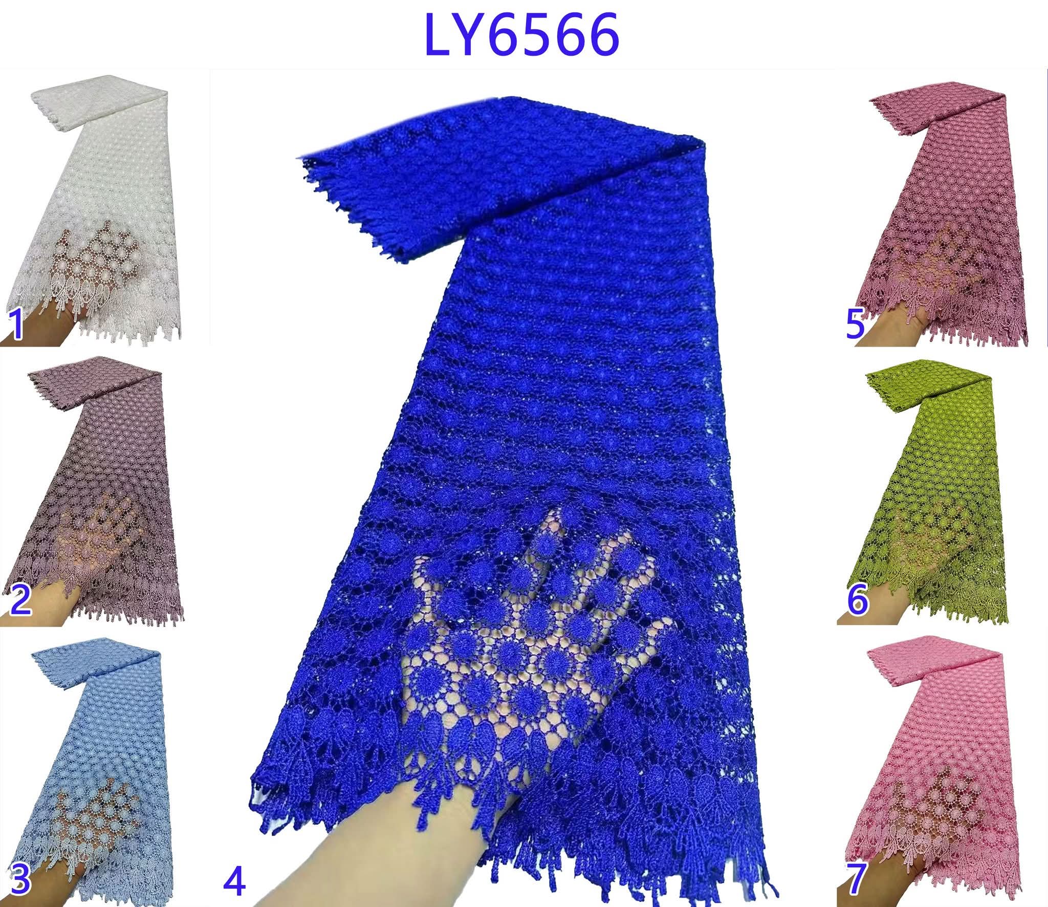 Blue lace scarf with fringe on a white background, surrounded by other scarves in different colors.
